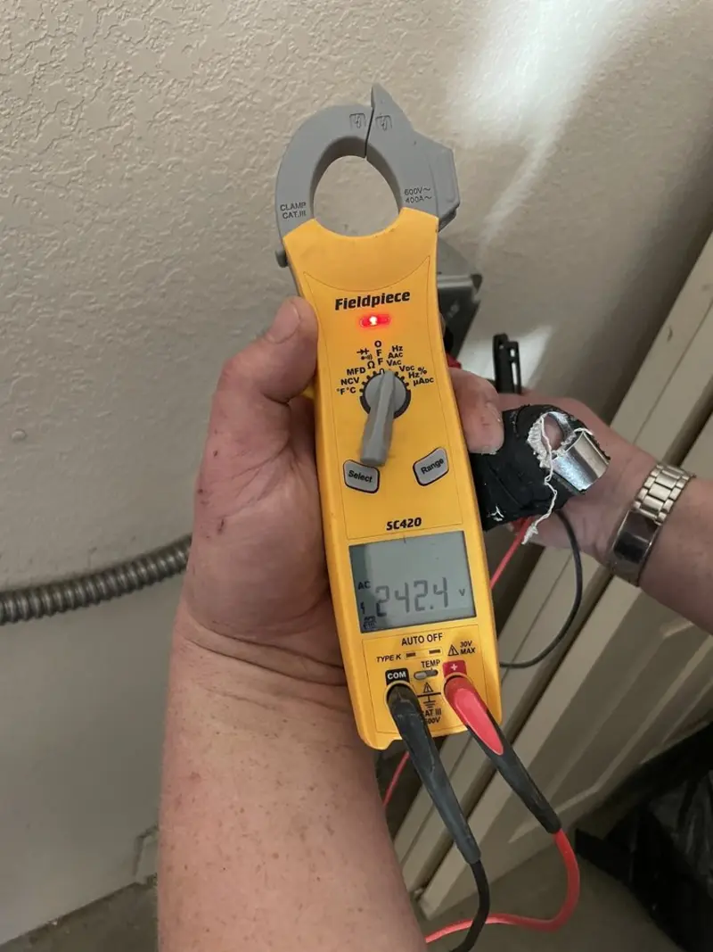 Voltage testing with clamp meter during Whole House Surge Protector in Cochran